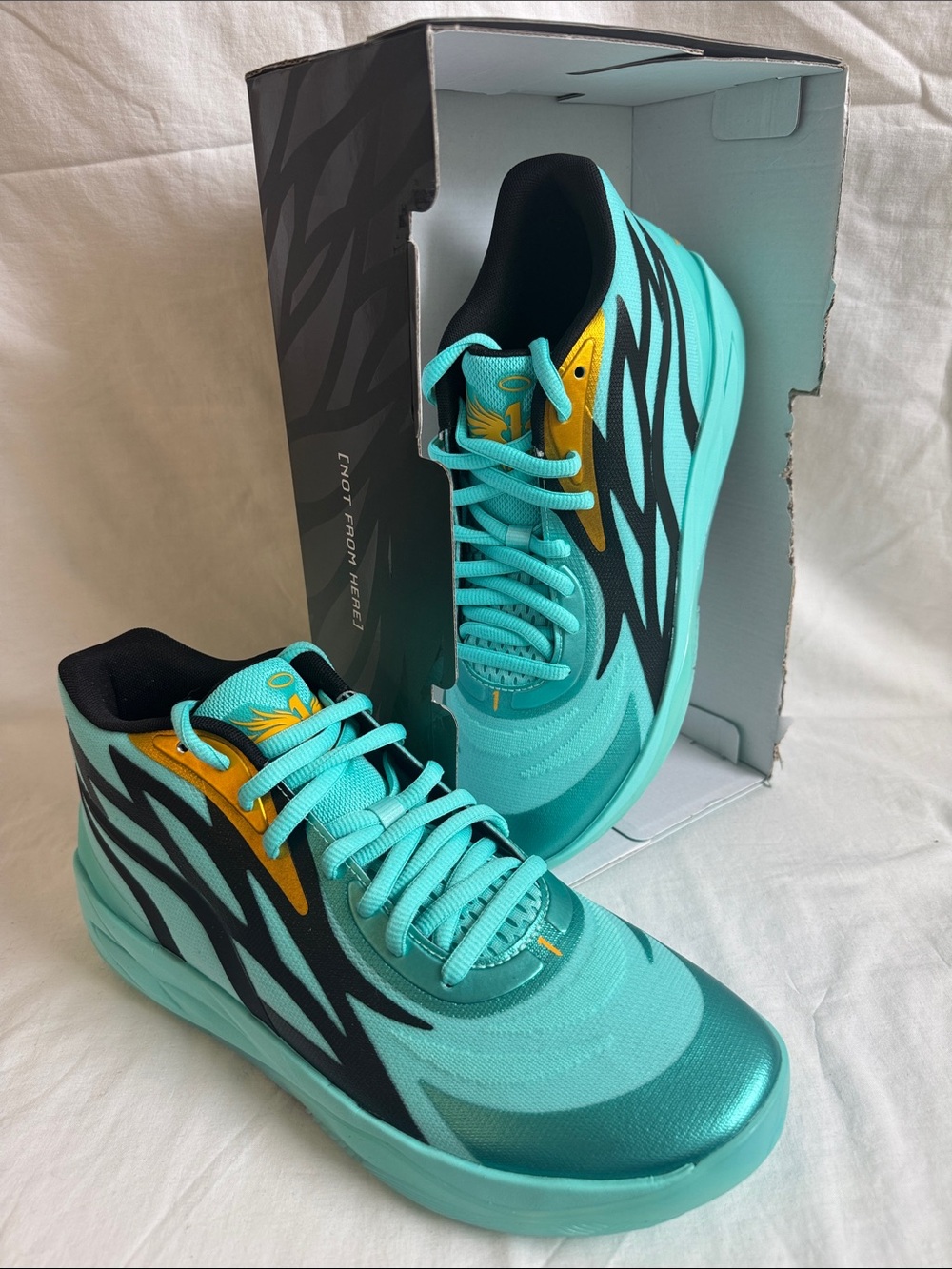 Puma Turquoise Athletic Sneakers with Black & Gold Accents